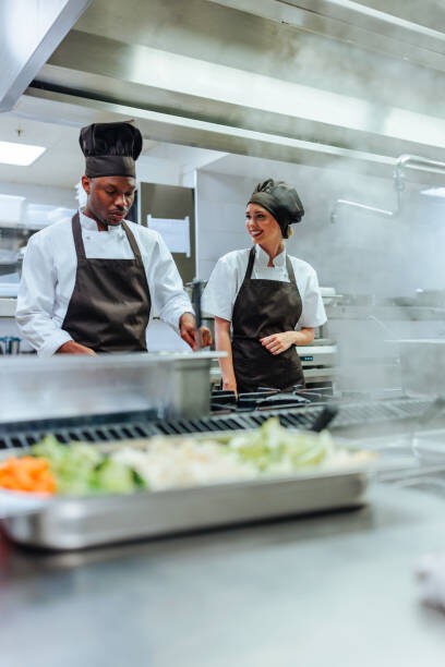 Guests being served plated food at a buffet